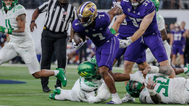 Washington Huskies running back Dillon Johnson runs against the Oregon Ducks in the Pac-12 Championship game.